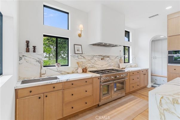 Interior, Kitchen, Marble Walls, Recessed Lighting, Stainless Steel Appliances, Wood Texture Flooring