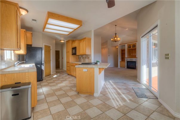 Chandelier, Fireplace, Interior, Kitchen, Pendant Lights, Tile Countertops