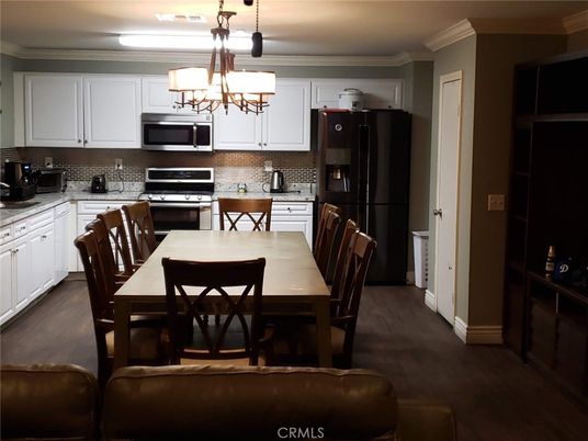 Chandelier, Dining room, Interior, Kitchen, Stainless Steel Appliances, Wood Texture Flooring