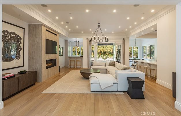 Chandelier, Fireplace, Interior, Living room, Pendant Lights, Recessed Lighting, Wood Texture Flooring