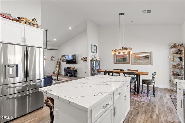 Dining room, Interior, Kitchen, Pendant Lights, Recessed Lighting, Stainless Steel Appliances, Wood Texture Flooring