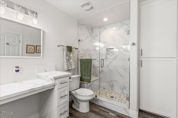 Bathroom, Glass Shower, Interior, Marble Walls, Recessed Lighting, Wood Texture Flooring