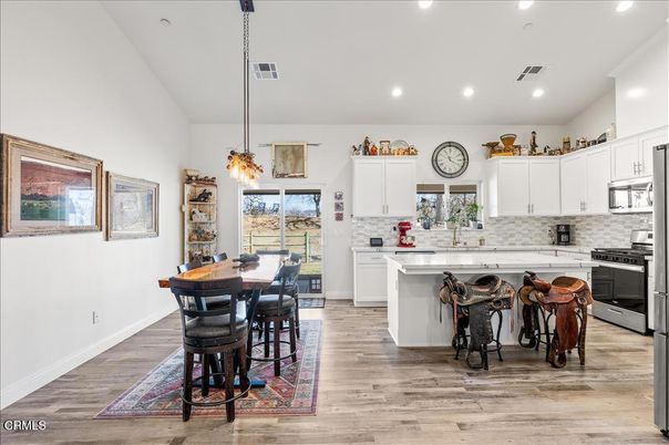 Dining room, Interior, Kitchen, Pendant Lights, Recessed Lighting, Stainless Steel Appliances, Wood Texture Flooring
