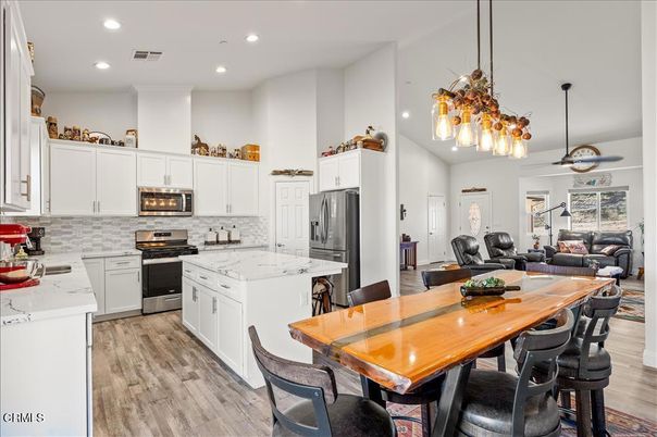 Dining room, Interior, Kitchen, Living room, Pendant Lights, Recessed Lighting, Stainless Steel Appliances, Wood Texture Flooring