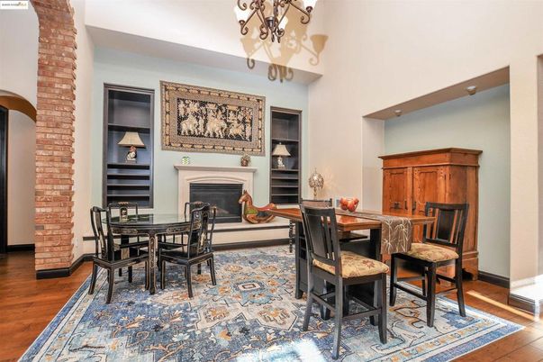 Chandelier, Dining room, Fireplace, Interior, Stone Walls, Wood Texture Flooring