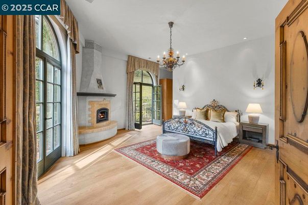 Bedroom, Chandelier, Fireplace, Interior, Recessed Lighting, Wood Texture Flooring