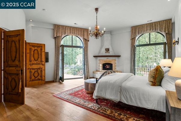 Bedroom, Chandelier, Fireplace, Interior, Recessed Lighting, Wood Texture Flooring
