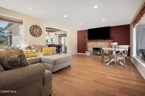 Dining room, Fireplace, Interior, Living room, Recessed Lighting, Wood Texture Flooring