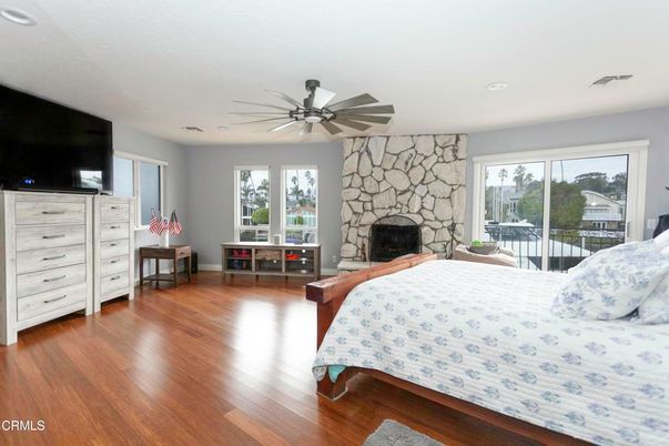 Bedroom, Fireplace, Interior, Recessed Lighting, Stone Walls, Wood Texture Flooring