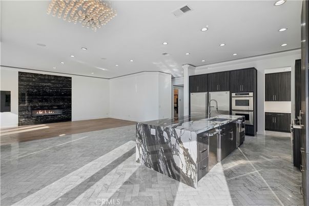 Fireplace, Interior, Kitchen, Recessed Lighting, Stainless Steel Appliances, Wood Texture Flooring