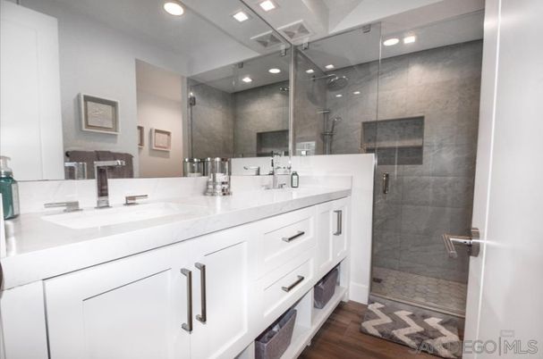 Bathroom, Dual Sink Vanities, Glass Shower, Interior, Recessed Lighting, Wood Texture Flooring