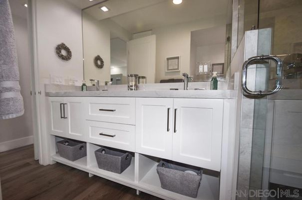 Bathroom, Dual Sink Vanities, Glass Shower, Interior, Recessed Lighting, Wood Texture Flooring