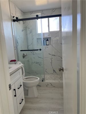 Bathroom, Glass Shower, Interior, Marble Walls, Wood Texture Flooring