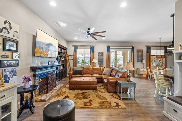 Dining room, Fireplace, Interior, Living room, Pendant Lights, Recessed Lighting, Wood Texture Flooring