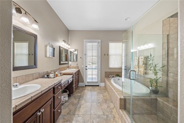 Bathroom, Dual Sink Vanities, Glass Shower, Interior, Recessed Lighting, Tile Countertops
