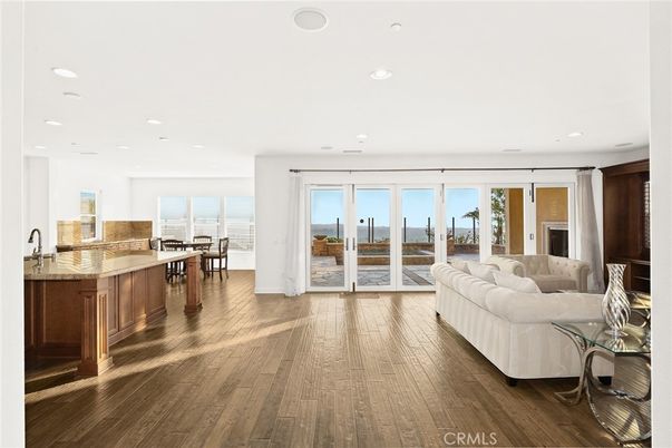 Dining room, Interior, Kitchen, Living room, Recessed Lighting, Water, Wood Texture Flooring