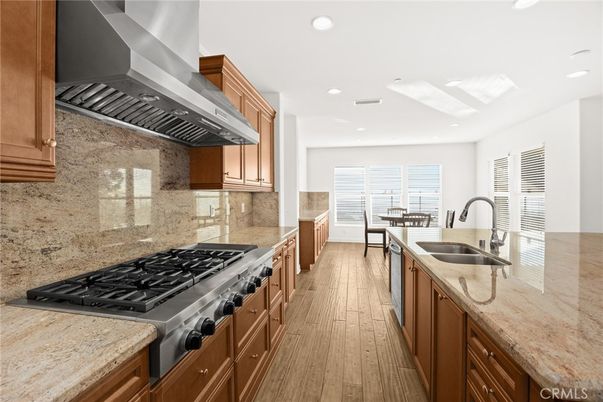 Dining room, Interior, Kitchen, Recessed Lighting, Stainless Steel Appliances, Wood Texture Flooring