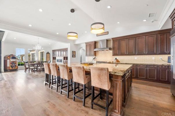 Chandelier, Dining room, Interior, Kitchen, Pendant Lights, Recessed Lighting, Stainless Steel Appliances, Wood Texture Flooring