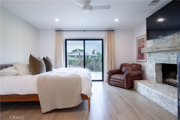 Bedroom, Fireplace, Interior, Recessed Lighting, Stone Walls, Wood Texture Flooring