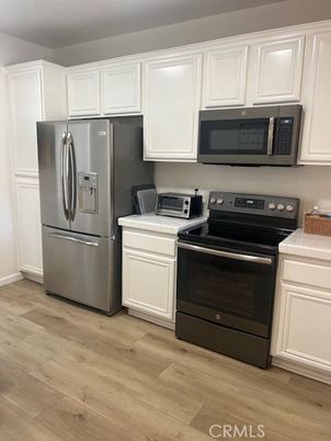 Interior, Kitchen, Tile Countertops, Wood Texture Flooring