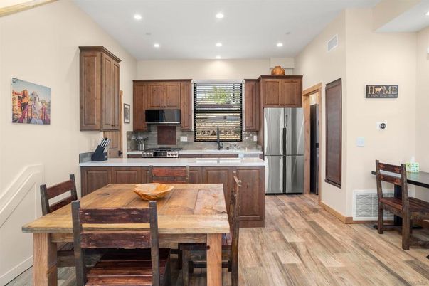 Dining room, Interior, Kitchen, Recessed Lighting, Stainless Steel Appliances, Wood Texture Flooring