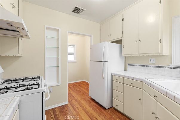 Interior, Kitchen, Tile Countertops, Wood Texture Flooring