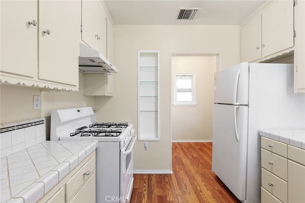 Interior, Kitchen, Tile Countertops, Wood Texture Flooring