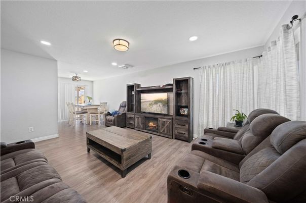 Dining room, Fireplace, Interior, Living room, Recessed Lighting, Wood Texture Flooring