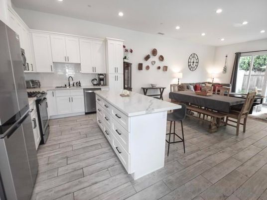 Dining room, Interior, Kitchen, Living room, Recessed Lighting, Stainless Steel Appliances, Wood Texture Flooring