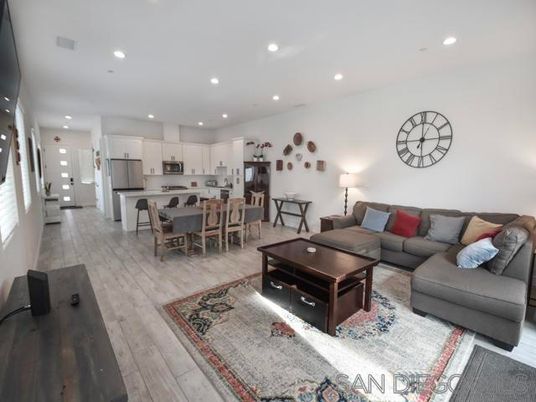 Dining room, Interior, Kitchen, Living room, Recessed Lighting, Stainless Steel Appliances, Wood Texture Flooring