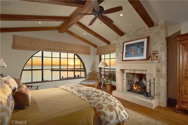 Bedroom, Fireplace, Interior, Recessed Lighting, Stone Walls, Water, Wooden Beams, Wood Texture Flooring