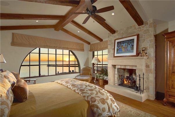 Bedroom, Fireplace, Interior, Recessed Lighting, Stone Walls, Water, Wooden Beams, Wood Texture Flooring
