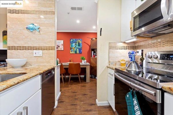 Dining room, Interior, Kitchen, Recessed Lighting, Stainless Steel Appliances, Wood Texture Flooring