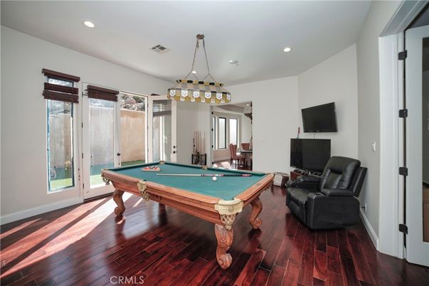 Billiard Table, Chandelier, Game Room, Interior, Pendant Lights, Recessed Lighting, Wood Texture Flooring