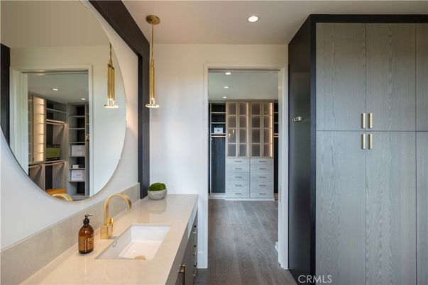Bathroom, Dual Sink Vanities, Interior, Pendant Lights, Recessed Lighting, Walk-in Closets, Wood Texture Flooring