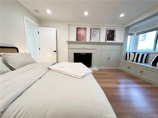 Bedroom, Fireplace, Interior, Recessed Lighting, Wood Texture Flooring