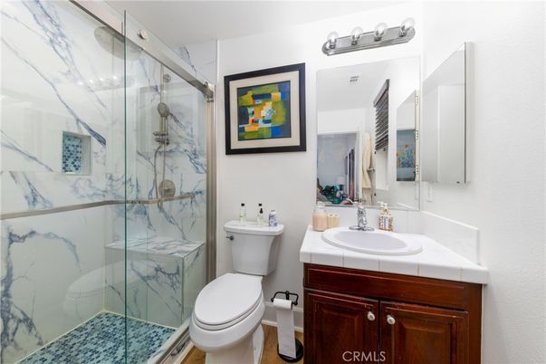 Bathroom, Glass Shower, Interior, Marble Walls, Tile Countertops