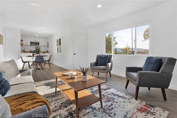 Dining room, Interior, Kitchen, Living room, Recessed Lighting, Stainless Steel Appliances, Wood Texture Flooring
