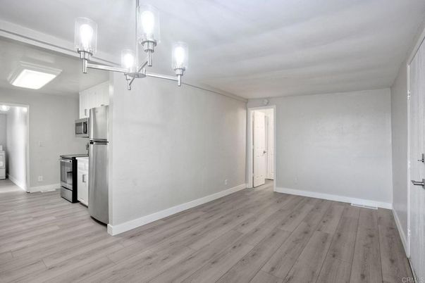 Chandelier, Empty room, Interior, Kitchen, Stainless Steel Appliances, Wood Texture Flooring