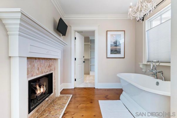 Bathroom, Chandelier, Fireplace, Free Standing Baths, Interior, Wood Texture Flooring