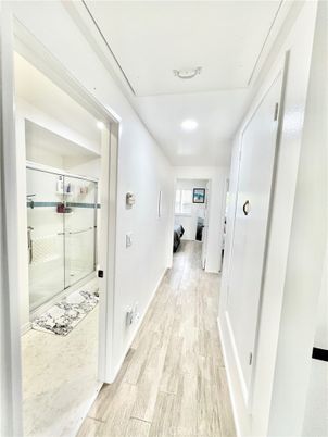 Bathroom, Glass Shower, Interior, Marble, Recessed Lighting, Wood Texture Flooring