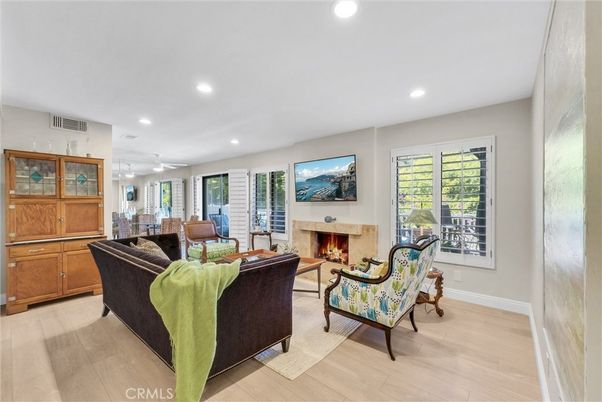 Dining room, Fireplace, Interior, Living room, Recessed Lighting, Wood Texture Flooring