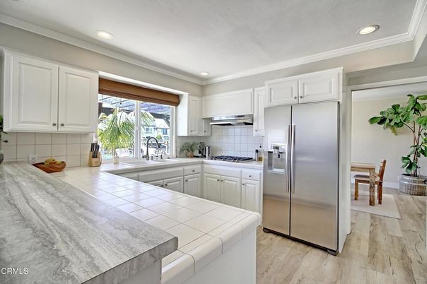 Interior, Kitchen, Recessed Lighting, Stainless Steel Appliances, Tile Countertops, Wood Texture Flooring