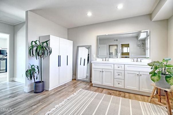 Bathroom, Dual Sink Vanities, Interior, Recessed Lighting, Wood Texture Flooring