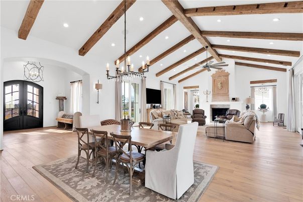 Chandelier, Dining room, Fireplace, Interior, Living room, Recessed Lighting, Wooden Beams, Wood Texture Flooring