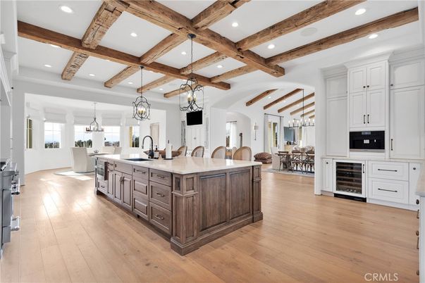 Chandelier, Dining room, Interior, Kitchen, Pendant Lights, Recessed Lighting, Stainless Steel Appliances, Wooden Beams, Wood Texture Flooring