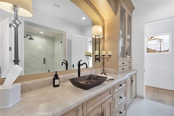 Bathroom, Dual Sink Vanities, Glass Shower, Interior, Recessed Lighting, Tile Countertops, Wood Texture Flooring
