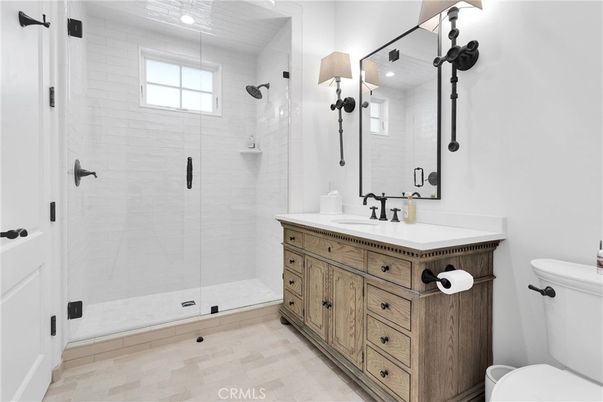 Bathroom, Dual Sink Vanities, Glass Shower, Interior, Recessed Lighting, Wood Texture Flooring