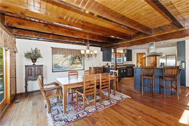 Chandelier, Dining room, Interior, Kitchen, Recessed Lighting, Stainless Steel Appliances, Wooden Beams, Wooden Ceilings, Wood Texture Flooring