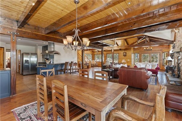 Chandelier, Dining room, Fireplace, Interior, Kitchen, Living room, Stainless Steel Appliances, Wooden Beams, Wooden Ceilings, Wood Texture Flooring, Wooden Walls